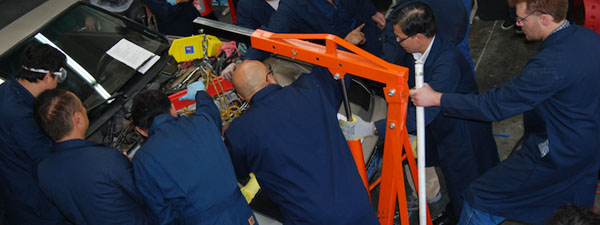 Certified EV Technicians removing engines